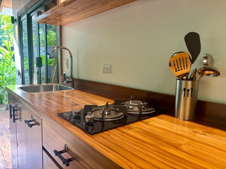 Dining area and kitchenette in the Studio Apartment at Makanas Beach Bungalows