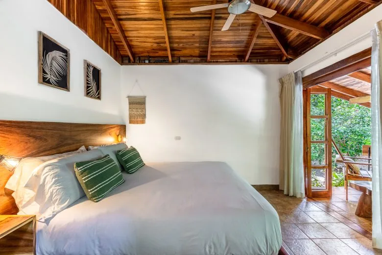 King bed in Standard King Bungalow 1 at Makanas Beach Bungalows